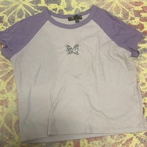 Purple crop top embroidered butterfly design on the front of it
